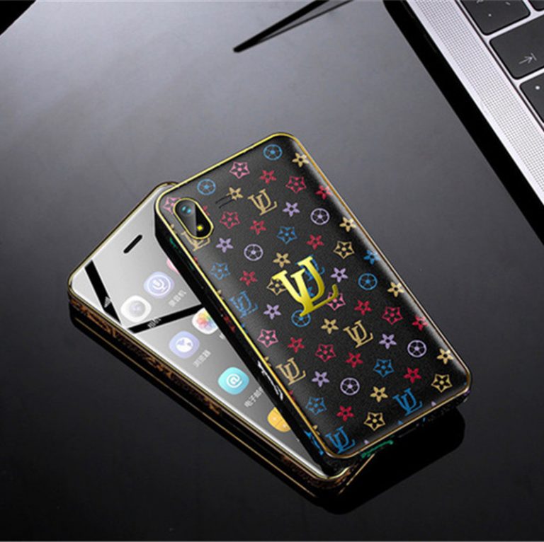 A sleek and compact Ulcool U2 Mini Smartphone with a leather back cover, shown on its edge, highlighting its premium design and portability.