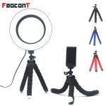A versatile 6.3-inch ring lamp mounted on a flexible octopus tripod, perfect for live streaming, photography, and makeup tutorials, showcasing its sleek design and adjustable lighting modes.