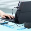 Compact USB-C Hub attached to an iPad Pro, showcasing multiple connected devices and a 4K external monitor for professional use
